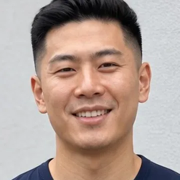 Sample input photo, cropped to face and hair: a man with a short undercut, used for the Raindance AI example