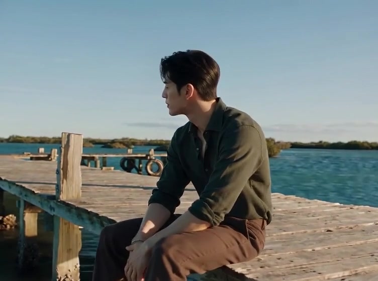Raindance AI video recreating the trend: a man on a wooden pier, a woman singing in the sea and the two together on the sand